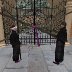 Patriarch and Canon Lawyer inspect seal on monastery gates