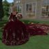 Mme. wearing a  red Velvet gown from Alisha.